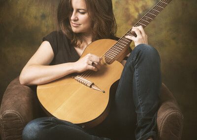 Susana Raya playing her RS6 Rick Turner guitar